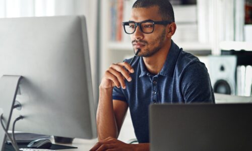 young man working at computer