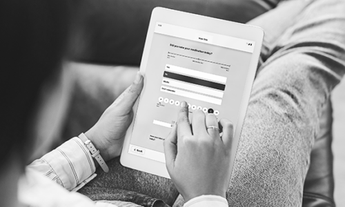 patient with tablet completing a questionnaire