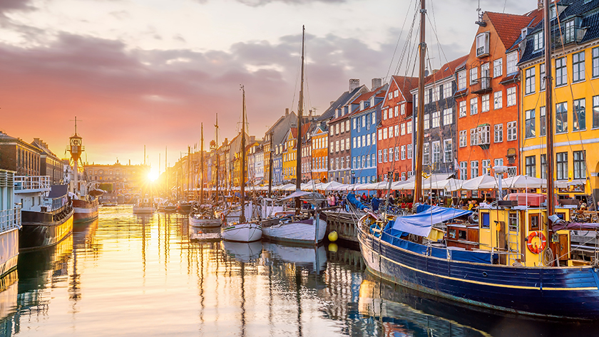 Copenhagen city skyline at sunset with Nyhavn port – YPrime at OCT Nordics 2025, Clarion Hotel & Congress, Booth 51